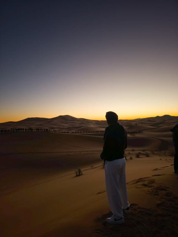 Adam in the desert at dusk