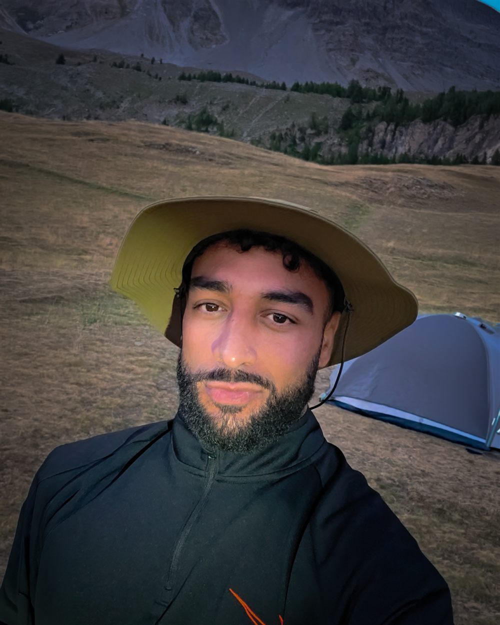 Adam at his bivouac in the mountains