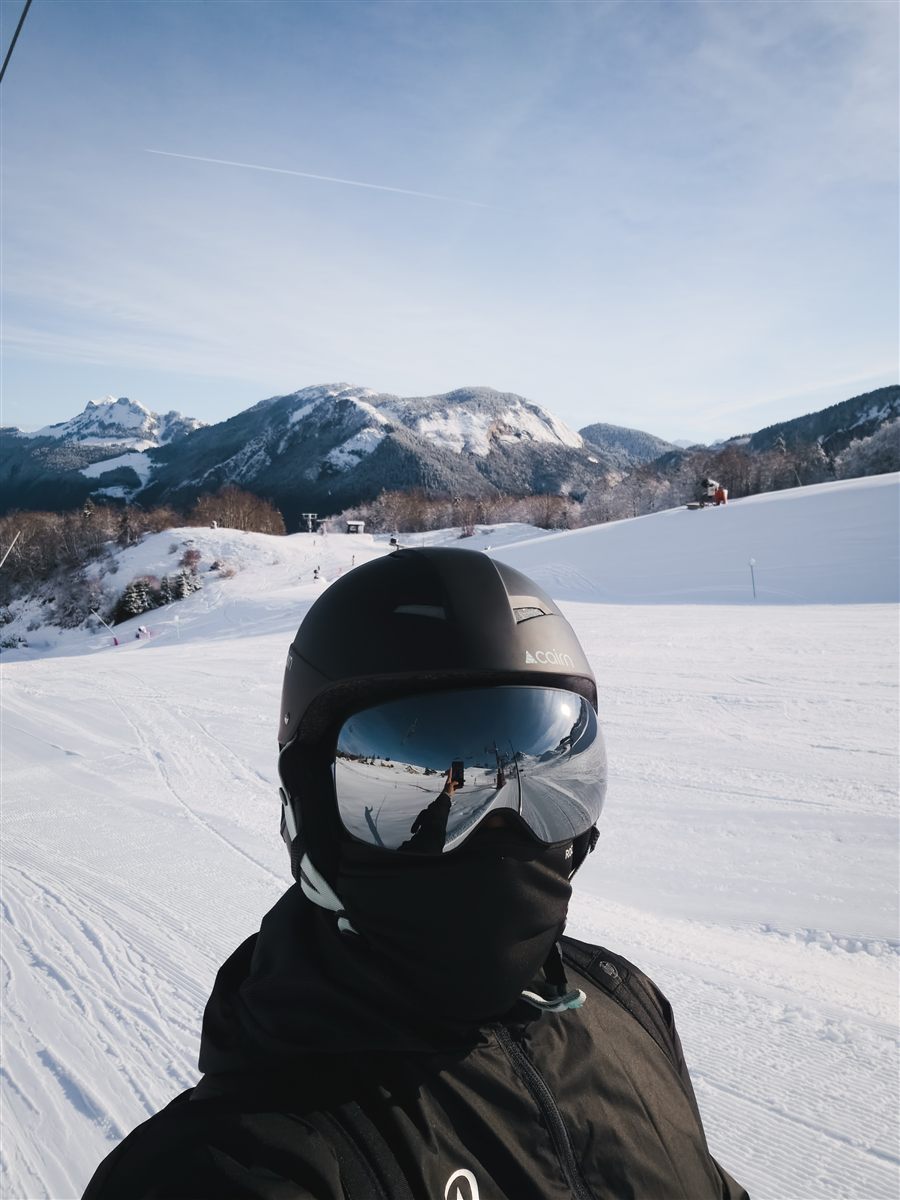 Adam in ski gear on a snowy slope