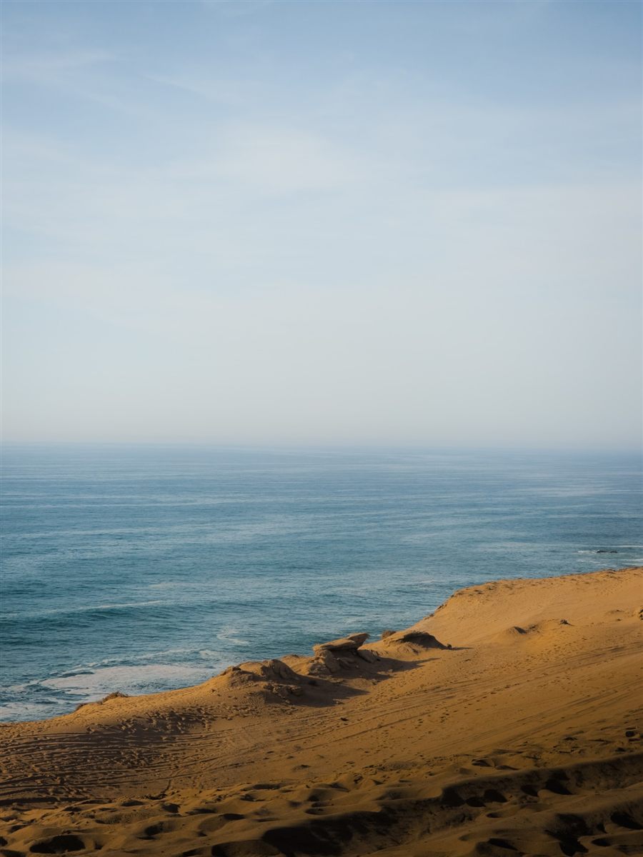 Golden dune sloping down to the ocean